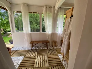 Bright relaxation room with wooden benches.